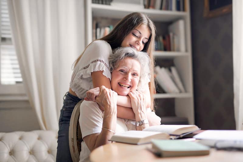 child hugging grandmother